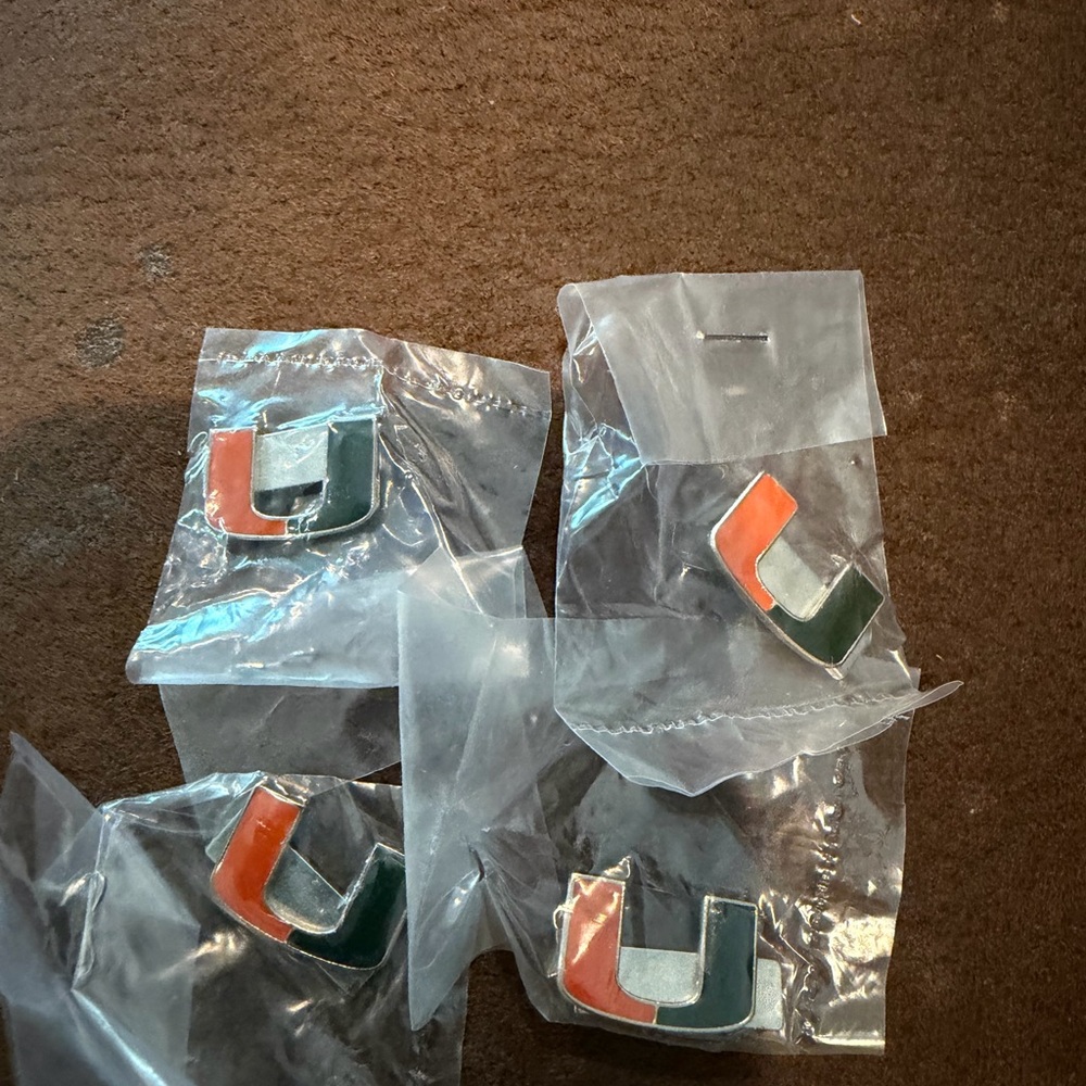 University of Miami UM set of 4 magnetic lapel or tie pins.